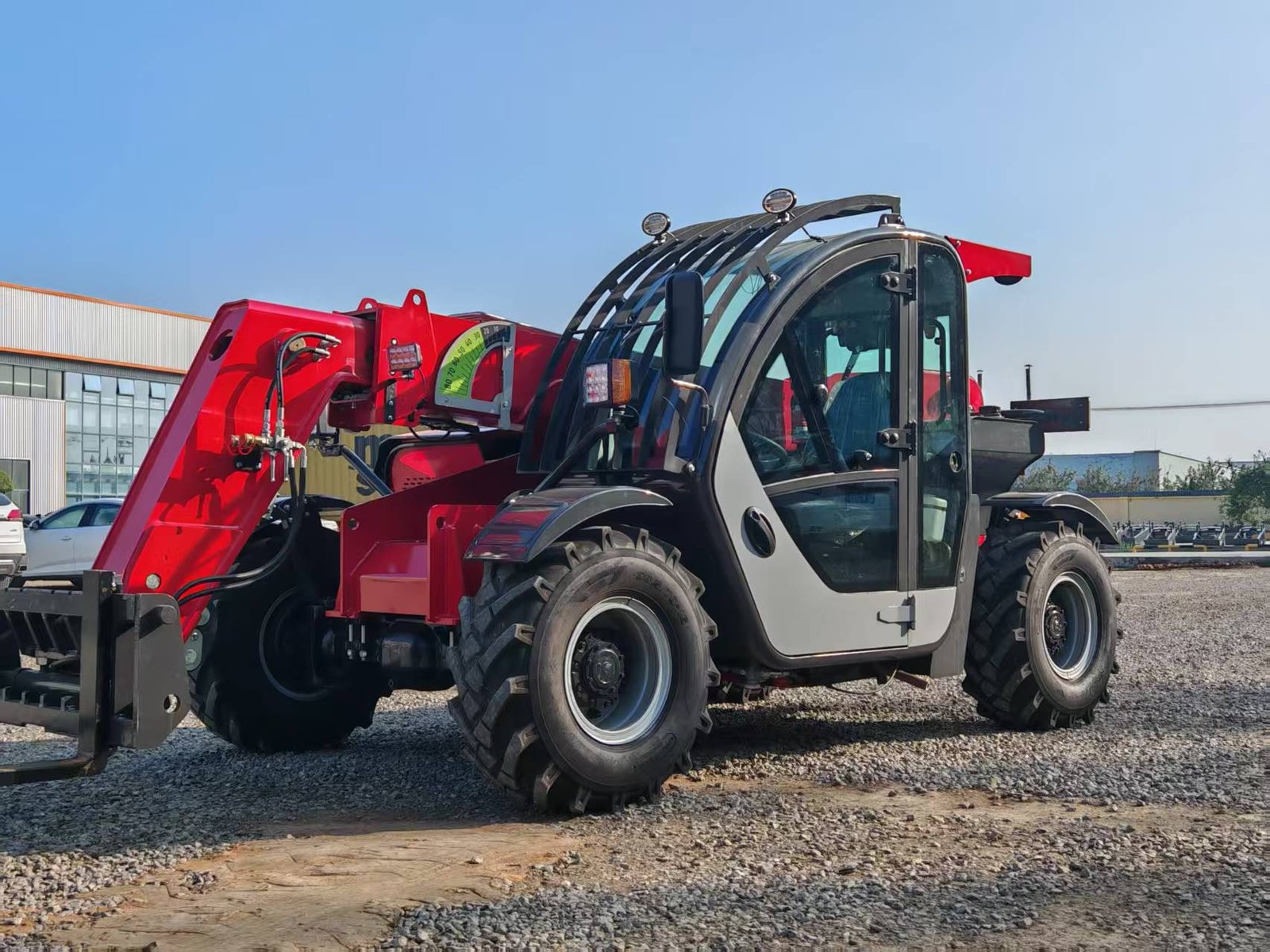 Telehandler lifting materials on a commercial construction site