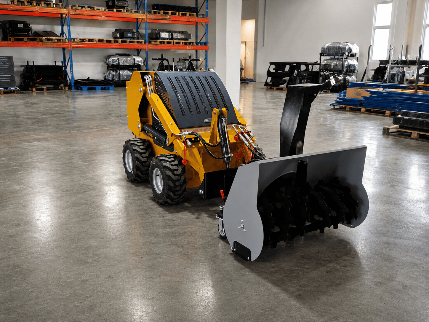 Municipal cleaning and snow attachment package for skid steer loader
