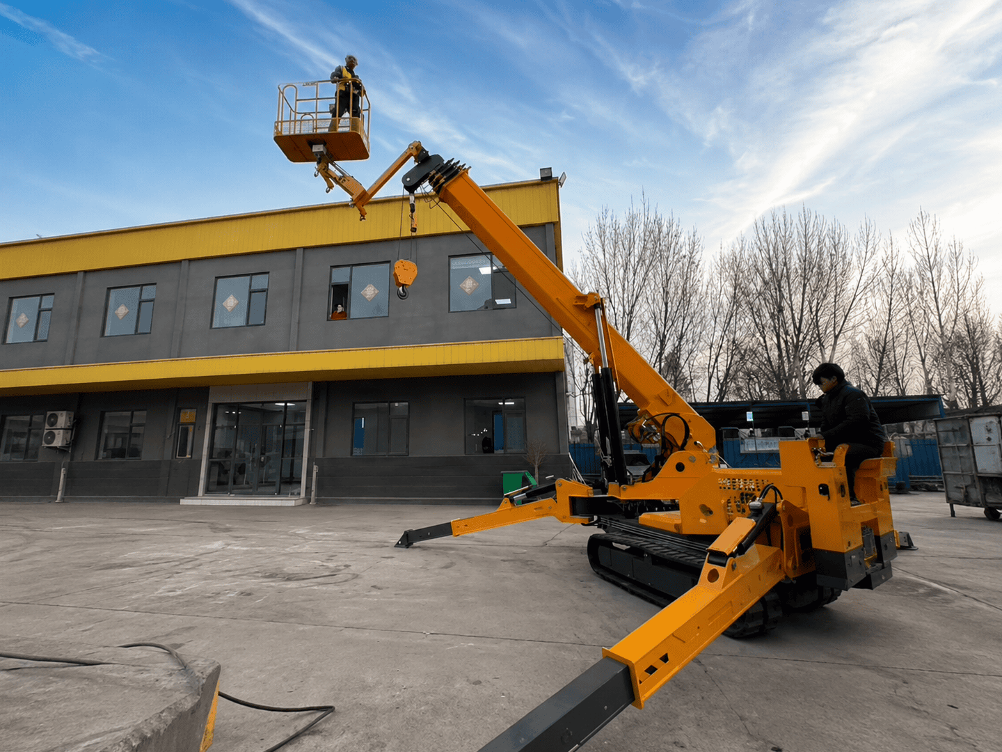 Spider crane positioning HVAC and industrial equipment indoors